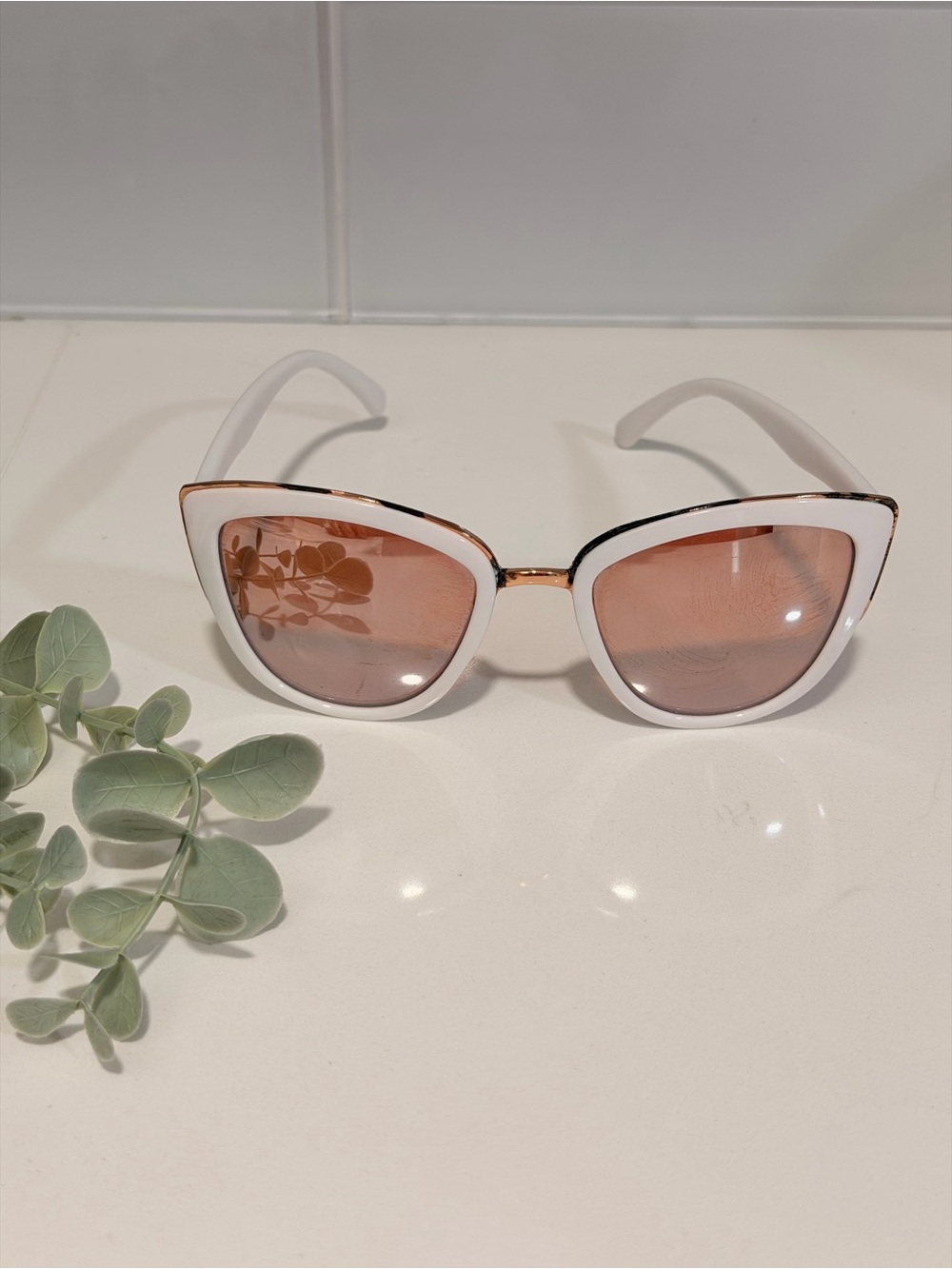 Modern White cat-eye sunglasses with gold-tone accents mirrored lenses Rosegold